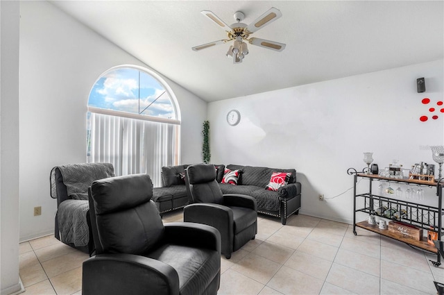 tiled living room featuring vaulted ceiling and ceiling fan