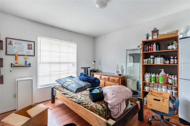 bedroom with wood-type flooring