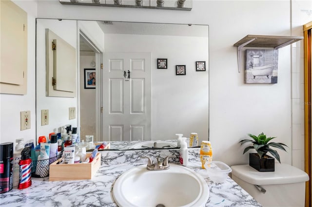 bathroom with sink and toilet