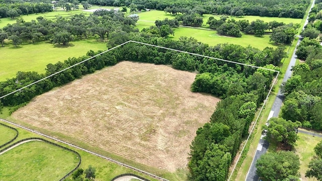 birds eye view of property with a rural view