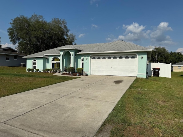 ranch-style house with a front yard and a garage