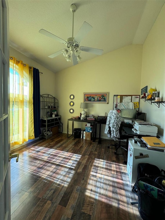 office space with plenty of natural light, ceiling fan, hardwood / wood-style floors, and lofted ceiling