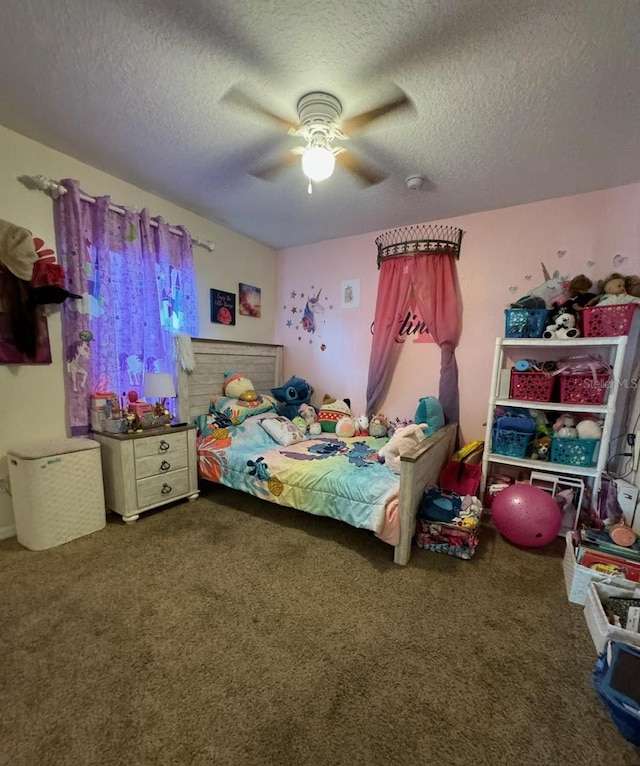 bedroom featuring carpet flooring, ceiling fan, and a textured ceiling