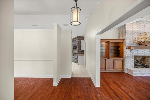 hallway featuring dark hardwood / wood-style flooring and crown molding