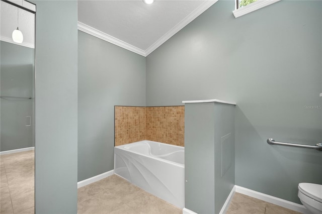 bathroom with a bathing tub, crown molding, tile patterned floors, and toilet