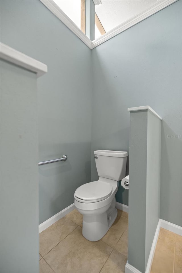 bathroom with tile patterned flooring and toilet