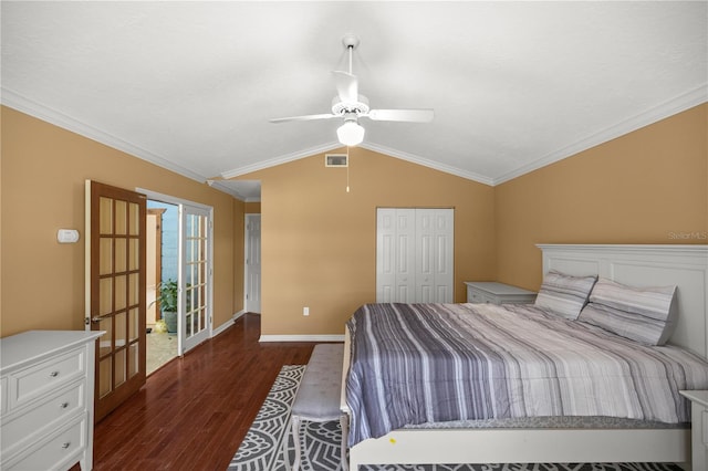 bedroom with a closet, vaulted ceiling, ceiling fan, ornamental molding, and dark hardwood / wood-style floors