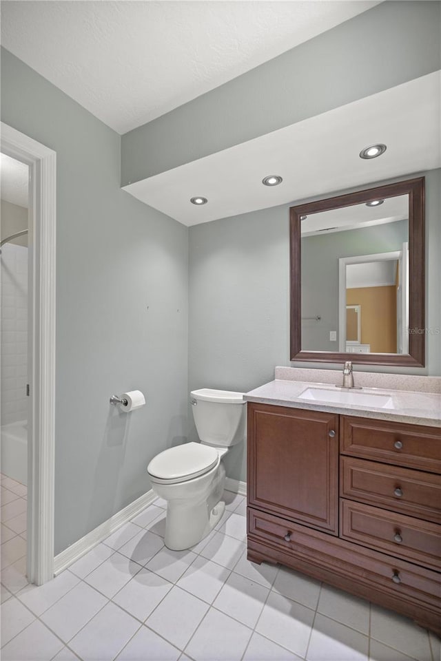 bathroom with tile patterned floors, vanity, and toilet