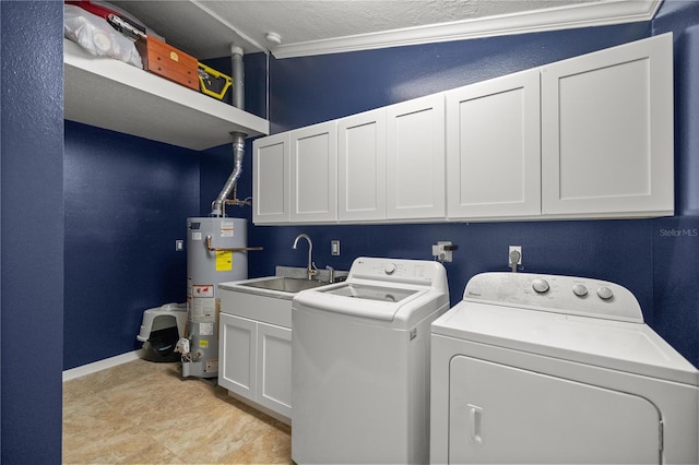 clothes washing area featuring cabinets, washing machine and dryer, crown molding, sink, and gas water heater