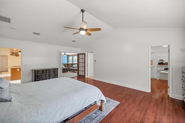 bedroom featuring ceiling fan, dark wood-type flooring, lofted ceiling, and ornamental molding