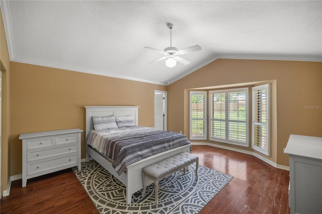 bedroom featuring vaulted ceiling, crown molding, ceiling fan, dark hardwood / wood-style floors, and a textured ceiling