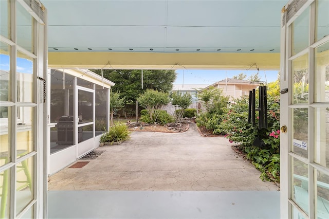 view of patio / terrace with a sunroom