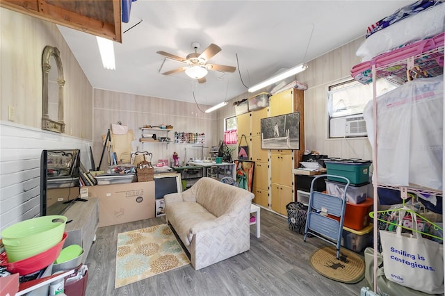 miscellaneous room featuring hardwood / wood-style floors, ceiling fan, and vaulted ceiling