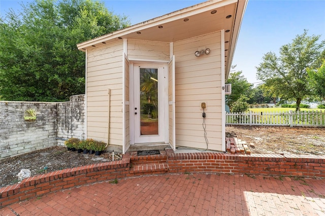 property entrance with fence