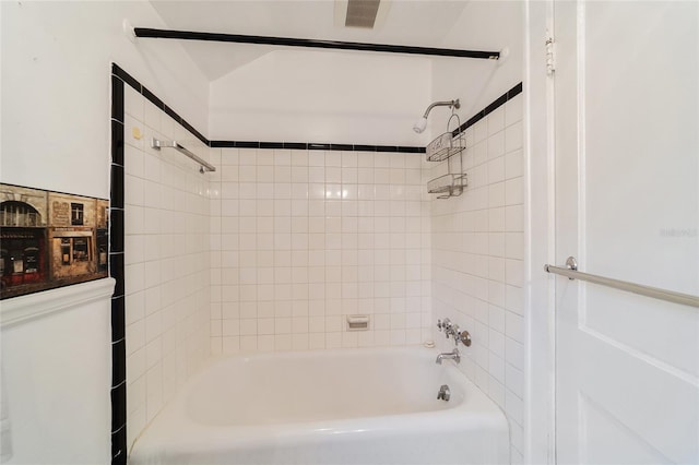 bathroom featuring washtub / shower combination and visible vents