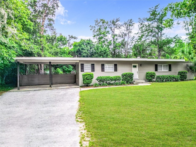 single story home featuring a carport and a front lawn