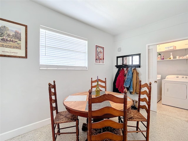 dining space featuring washing machine and dryer