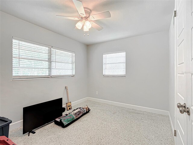 interior space featuring ceiling fan