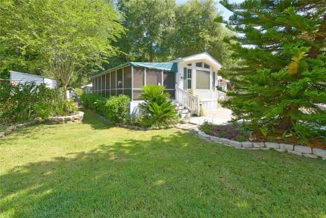 view of yard with a sunroom