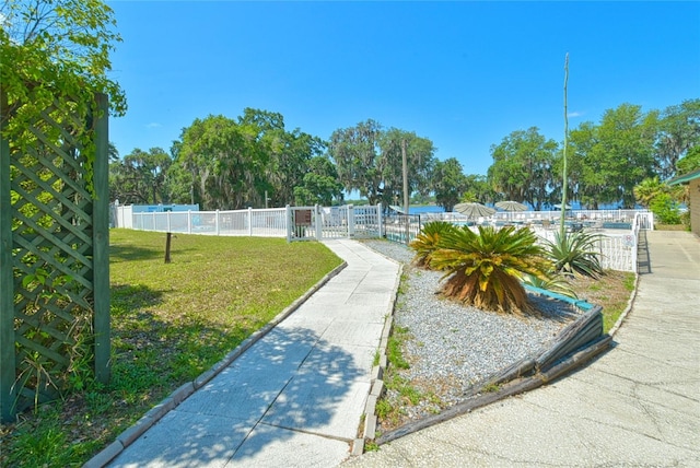 surrounding community featuring a lawn