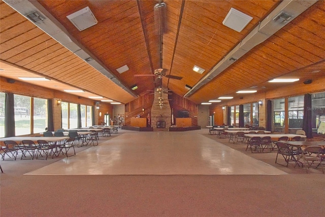 interior space with carpet, ceiling fan, and wood ceiling