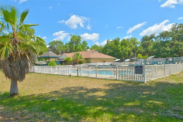 view of yard featuring a community pool