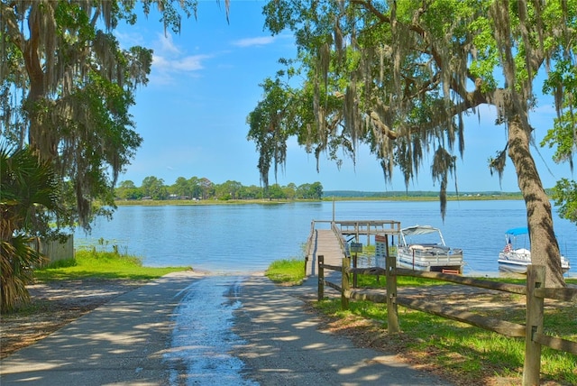 property view of water with a dock