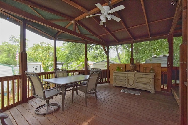 sunroom / solarium featuring ceiling fan and lofted ceiling