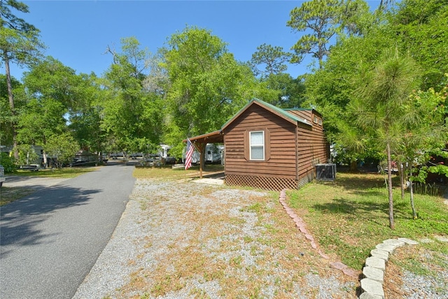 view of home's exterior featuring a lawn