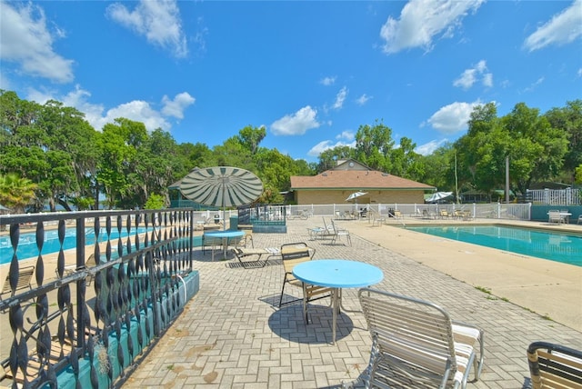 view of terrace featuring a community pool