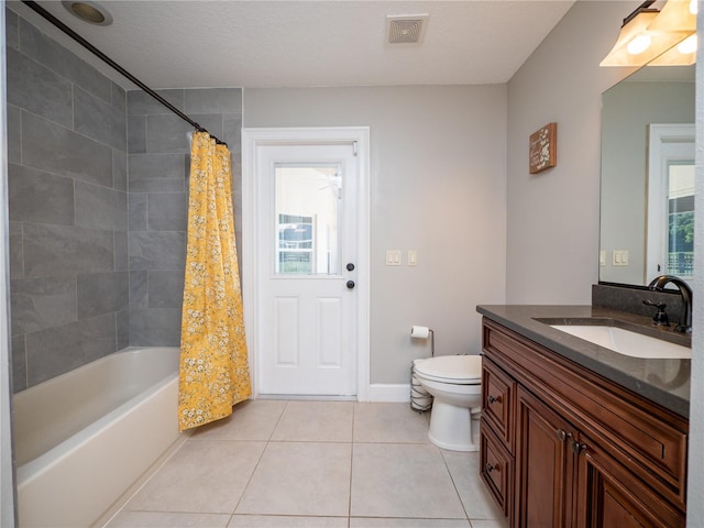 full bathroom with toilet, tile flooring, shower / tub combo, vanity, and a textured ceiling