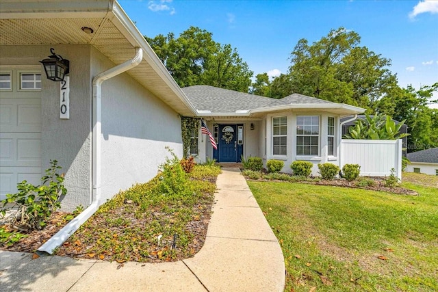 entrance to property with a yard