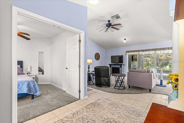 tiled bedroom featuring lofted ceiling