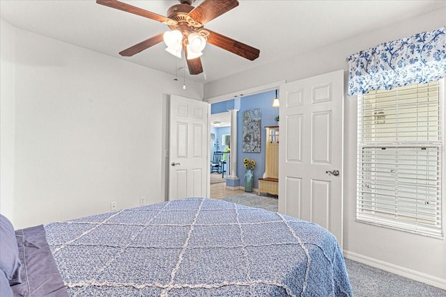 bedroom with ceiling fan and light colored carpet