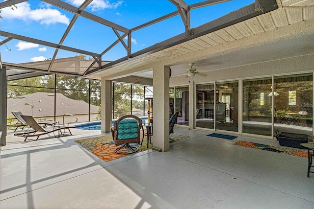 view of patio with ceiling fan and a lanai