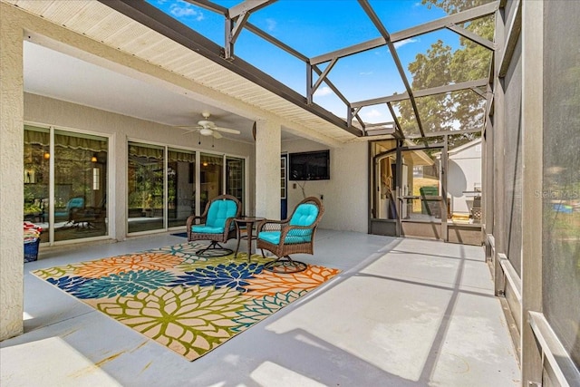 sunroom / solarium with beam ceiling and ceiling fan