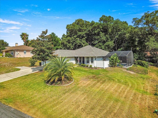 ranch-style home with a lanai and a front yard