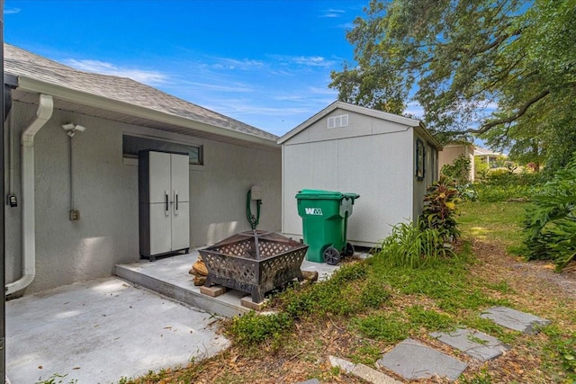 exterior space with a storage shed