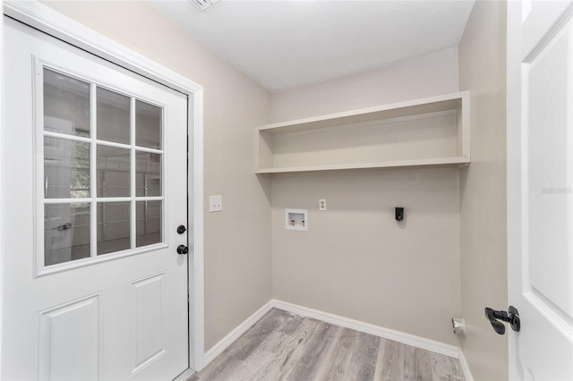 laundry area featuring washer hookup, hookup for an electric dryer, and light hardwood / wood-style flooring