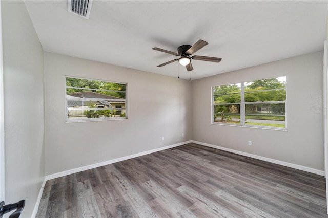 spare room with ceiling fan and hardwood / wood-style flooring