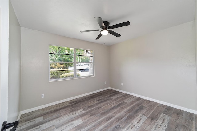 empty room featuring ceiling fan and hardwood / wood-style flooring