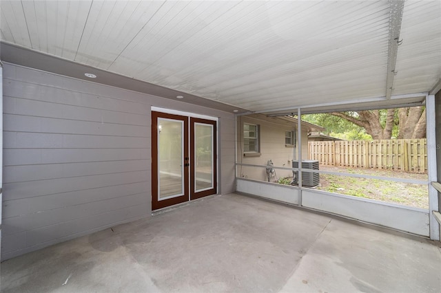 unfurnished sunroom featuring french doors and plenty of natural light