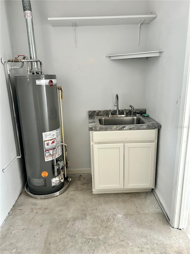 utility room featuring water heater and sink