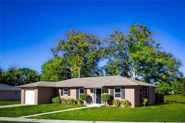 ranch-style home featuring a front yard and a garage