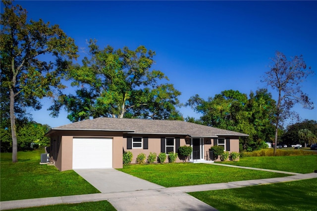 ranch-style home featuring central AC, a front yard, and a garage