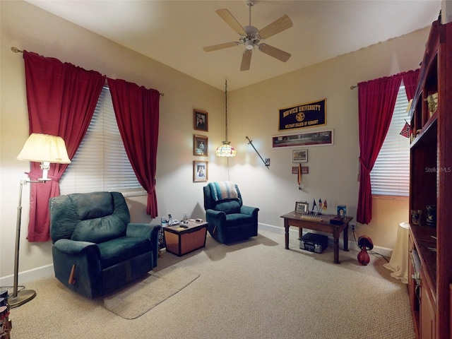 sitting room featuring carpet flooring and ceiling fan