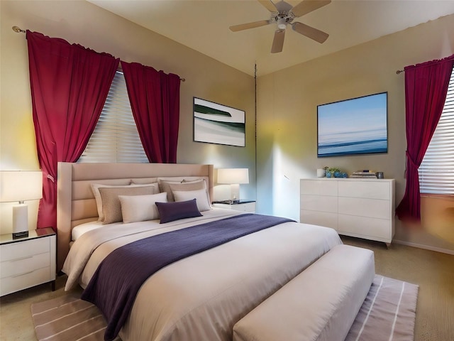 bedroom featuring light carpet and ceiling fan