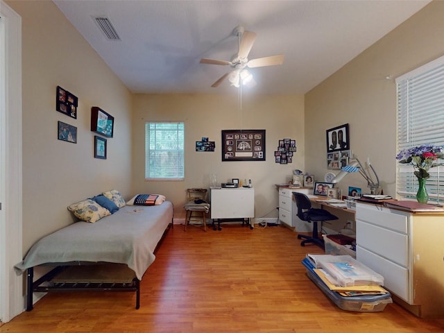 bedroom with ceiling fan and light wood-type flooring