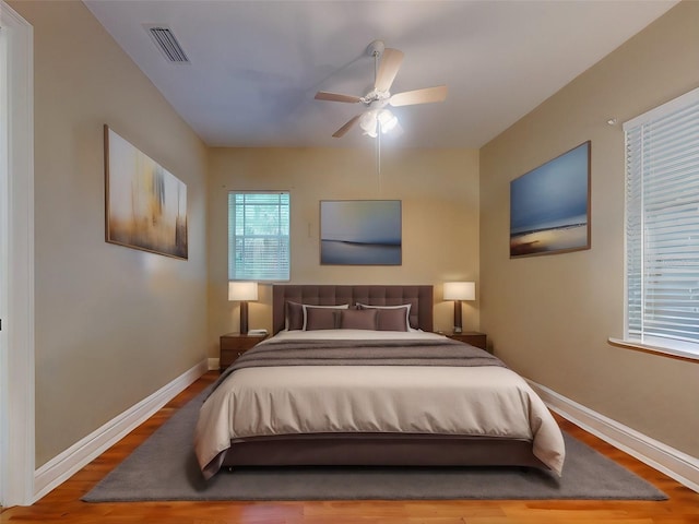 bedroom with hardwood / wood-style flooring and ceiling fan