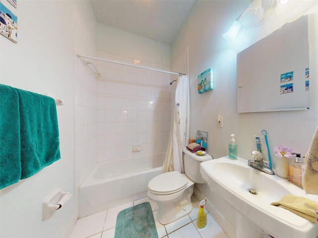 bathroom featuring toilet, shower / bath combo, and tile patterned floors